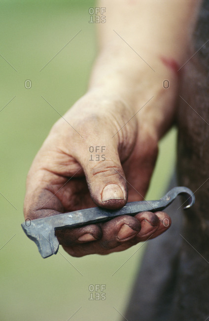 Man holding hook tool