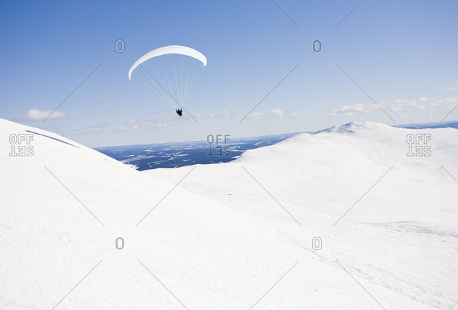 Paragliding in the north of Sweden amongst mountains