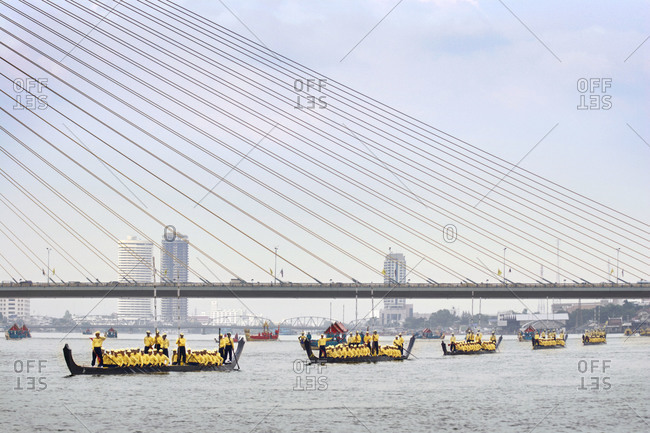 Boats traveling under Rama VIII bridge