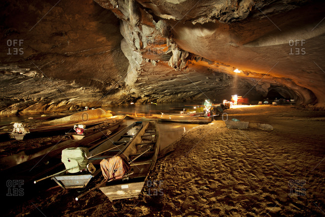 Canoes in  an underground cave in Laos