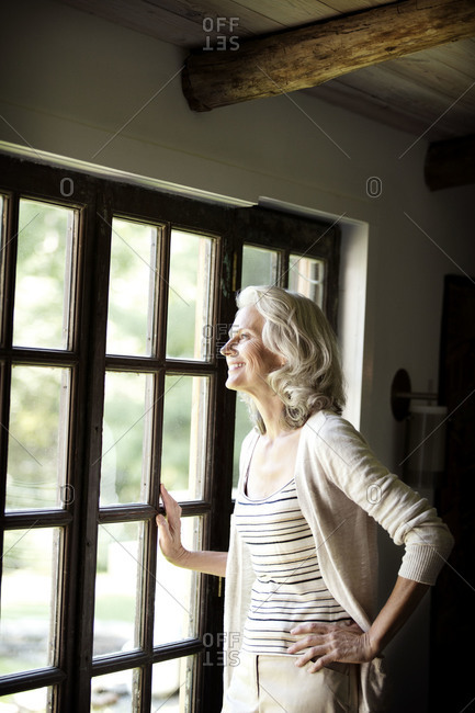 Senior woman staring out of a window