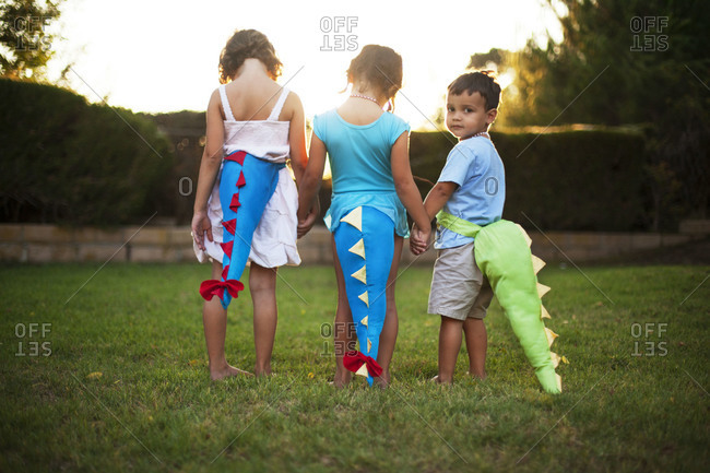 Children Wearing Dinosaur Tail Costumes