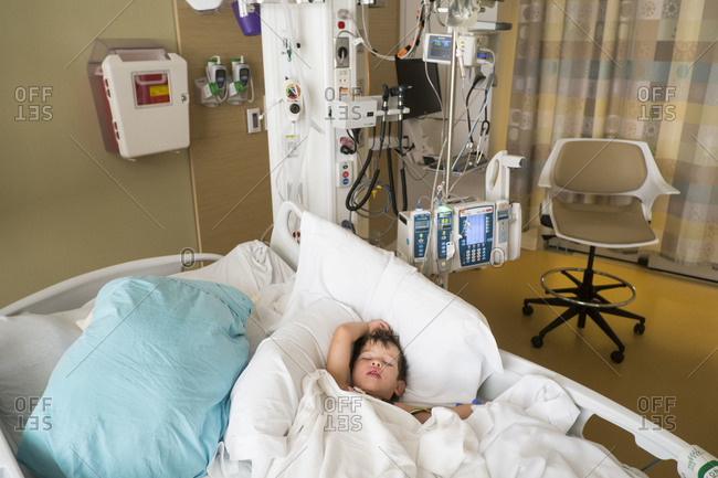 Boy sleeping in a hospital bed