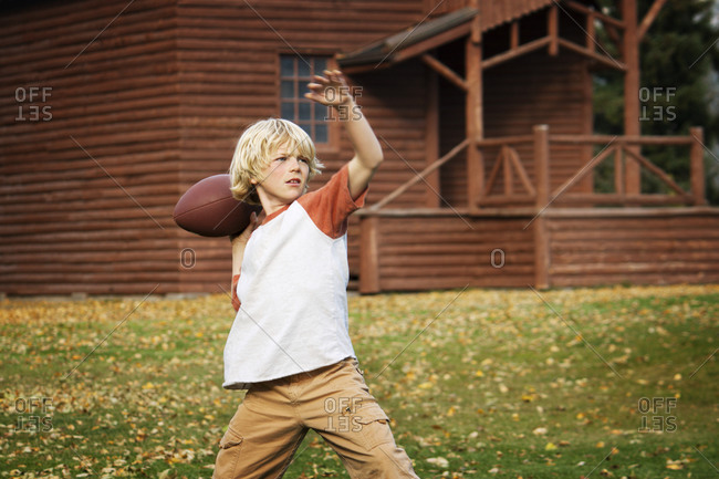 A boy throws a football