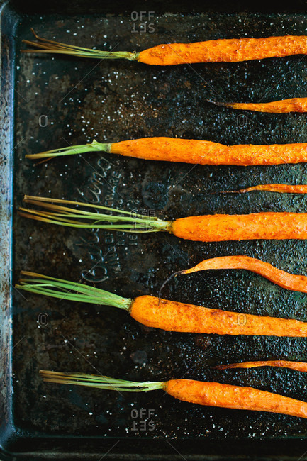 Roasted carrots on baking tray close up