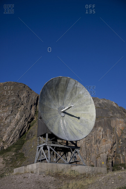 A radio telescope at the top of a mountain