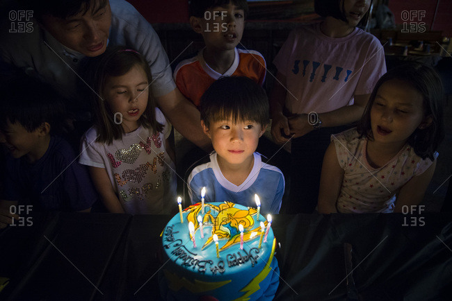 Boy celebrating his birthday with friends and family