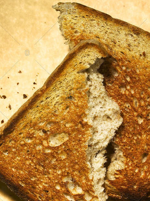 A piece of toast ripped in half