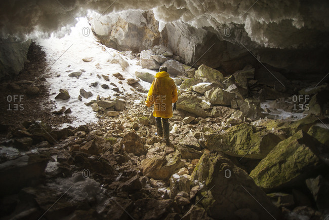 Person exiting a cave