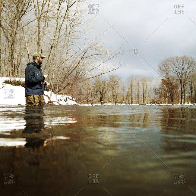 Man fly-fishing on the Salmon River in Pulaski, NY, USA