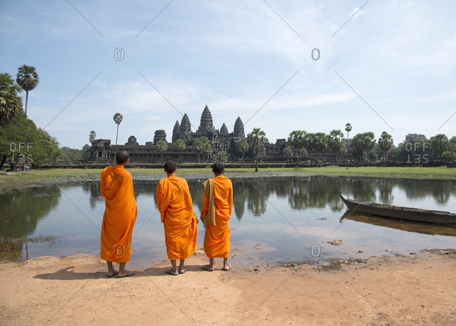 Monks looking at Angkor Wat, Cambodia