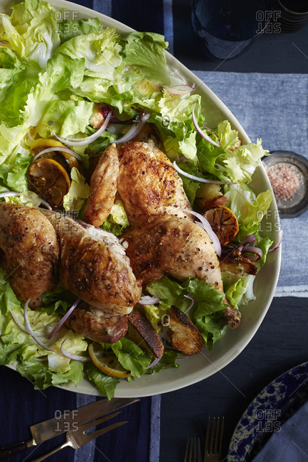 Roasted chicken served with lettuce