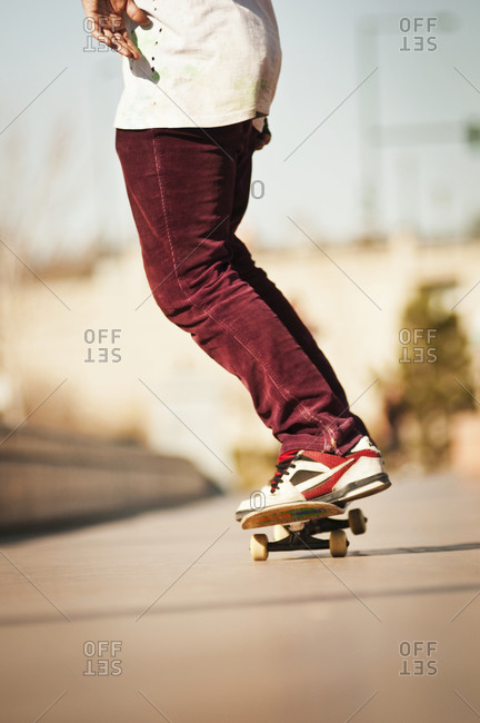 Low level view of skater riding skateboard