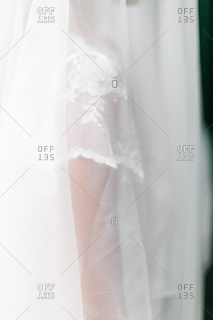 Bride covered in veil close up