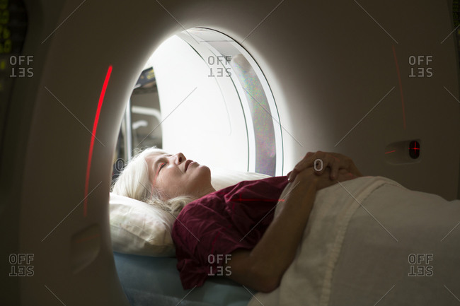 Senior female patient in a diagnostic imaging machine