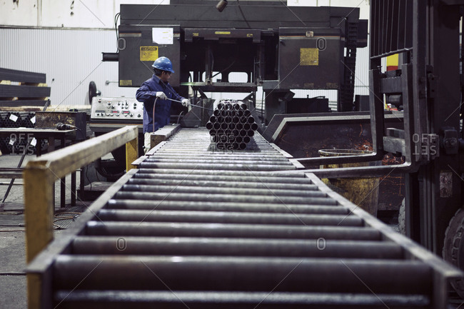 Steel factory worker on assembly line