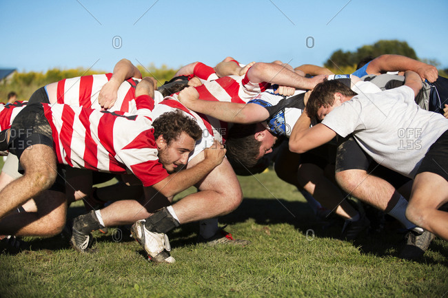 Two rugby teams engaged in a scrum
