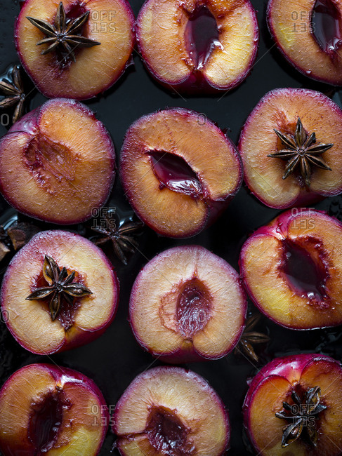 Sliced plums with star anise
