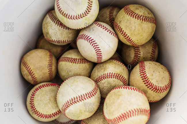 A bucket full of baseballs