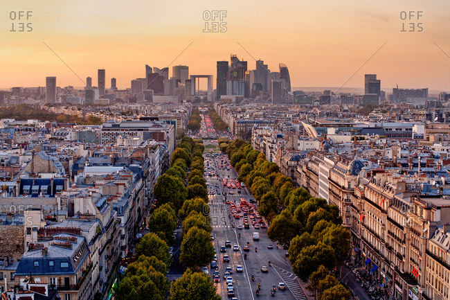 The Avenue de la Grande Armee lined with old classic Parisian buildings leads to the modern business district