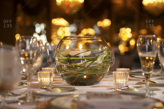 A glass globe with a floating tea light