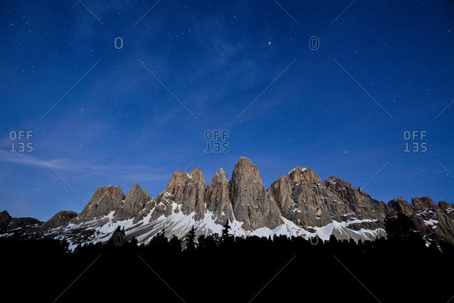 The starry sky above the Odle-Villnoss massif in South Tyrol, Italy