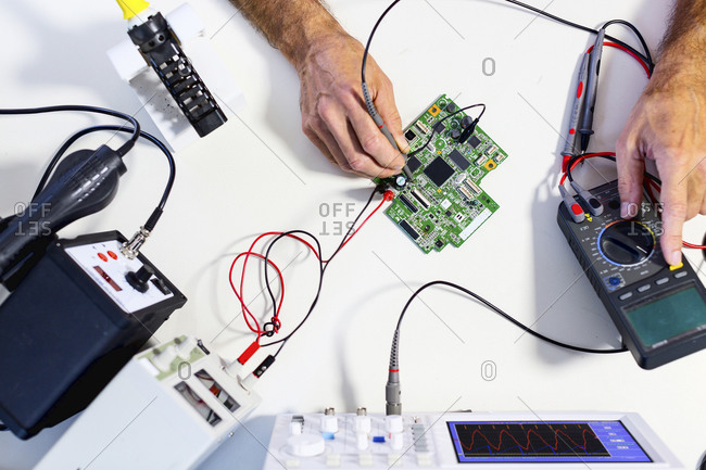 Person working in an electronics laboratory