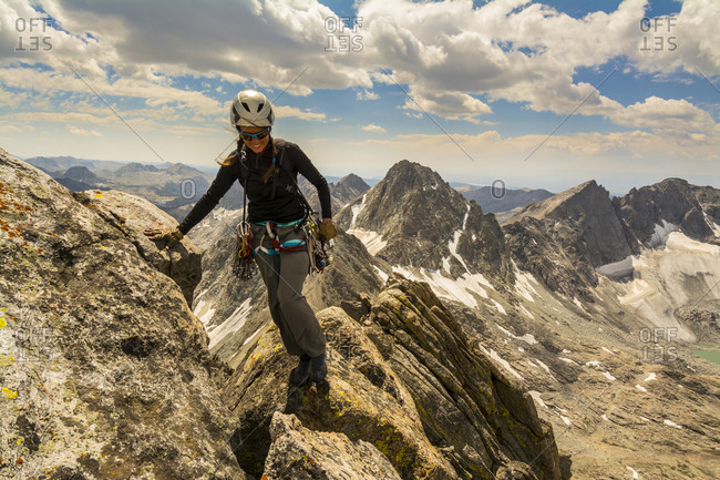 A woman rock climber in Titcomb Basin, Wind River Range, Pinedale, Wyoming