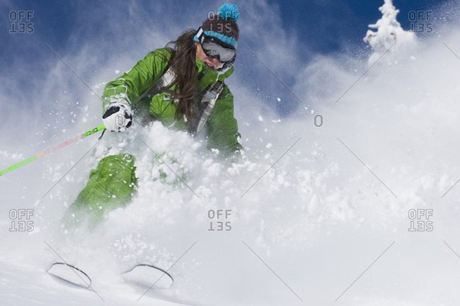 Woman skiing deep powder at Alta, Utah