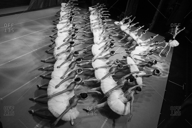Looking down on a ballet company performing Swan Lake