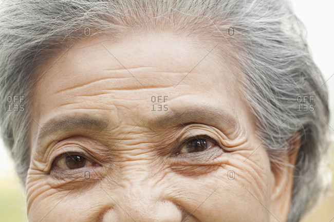 Wrinkles around a woman\'s eyes
