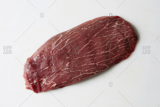 Raw blade steak on white background