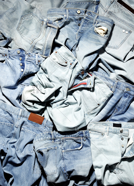 Pile of button fly jeans