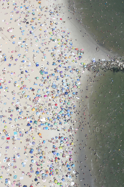 Aerial view of a crowded beach in Coney Island, Brooklyn, NYC
