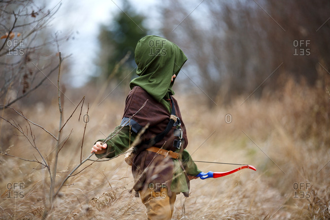 Boy in Robin Hood costume with bow