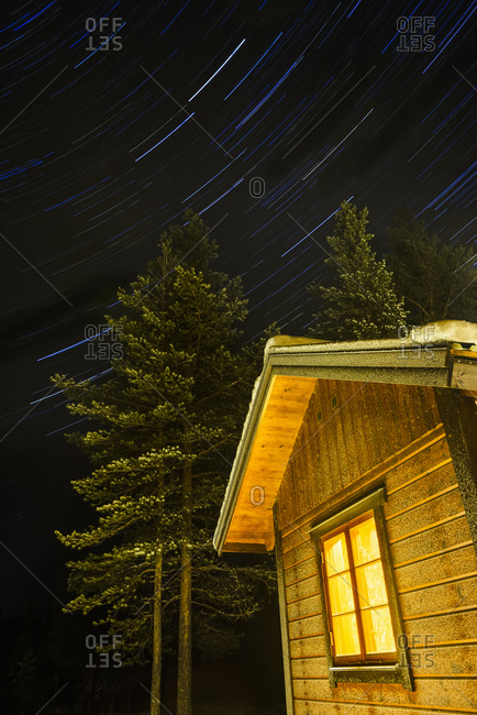 Wooden building against starry sky