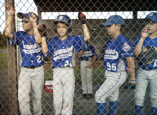 Little league players in the dugout