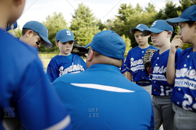 A little league coach gives his team a pep talk
