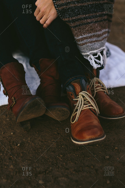 Close up of couple wearing leather boots