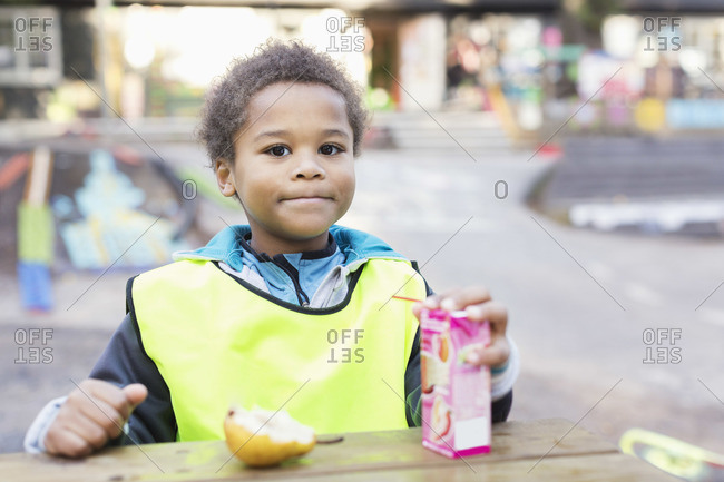 Portrait of boy with juice box