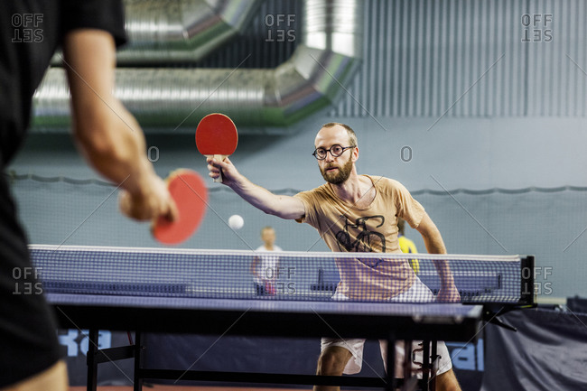 Man playing indoor ping pong game