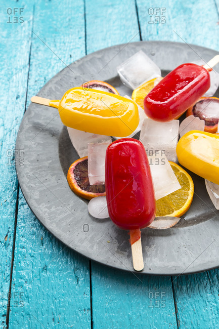 Ice lollies with blood orange and orange ice cream