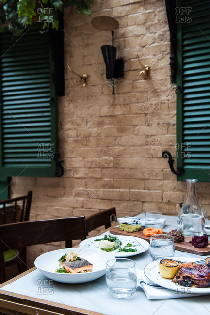 New York City, NY, USA - November 8, 2014: Table set for lunch outdoors at Margaux at the Marlton Hotel