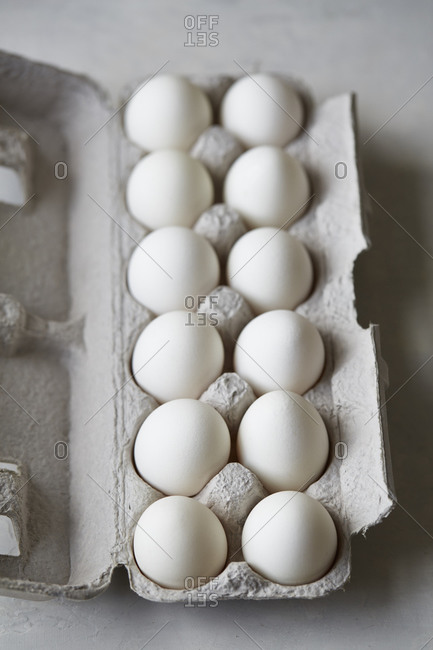 A dozen eggs in carton