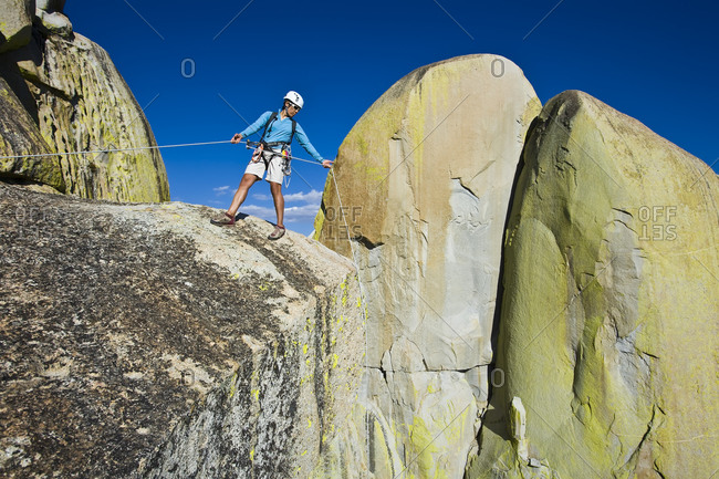Rock climber prepares to descend