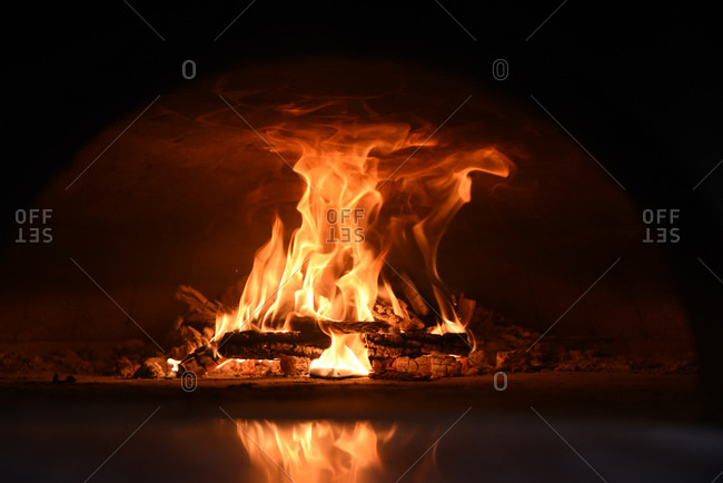 Flames inside a wood-fired pizza oven