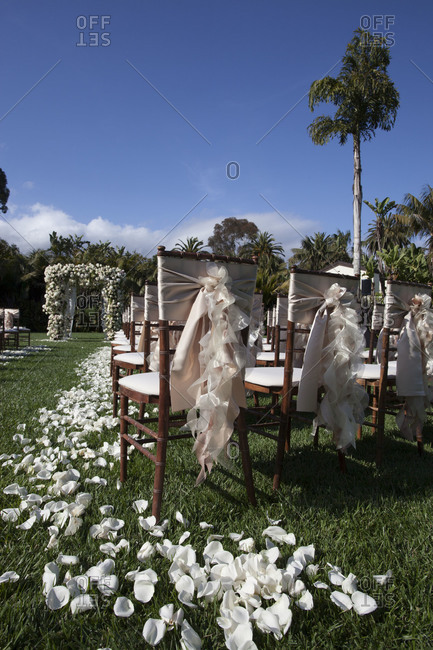 Wedding chairs set up on hotel lawn