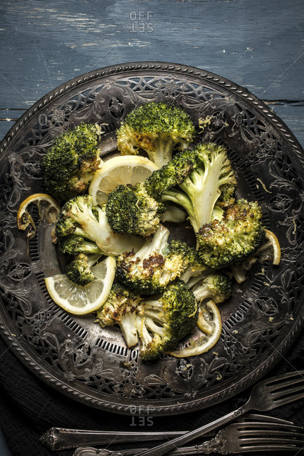 Roasted broccoli served on an antique plate