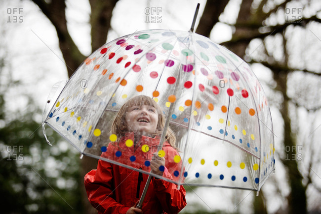 A little girl in a bucket umbrella