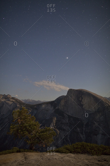 Stars twinkling above Half Dome in Yosemite National Park, California, USA